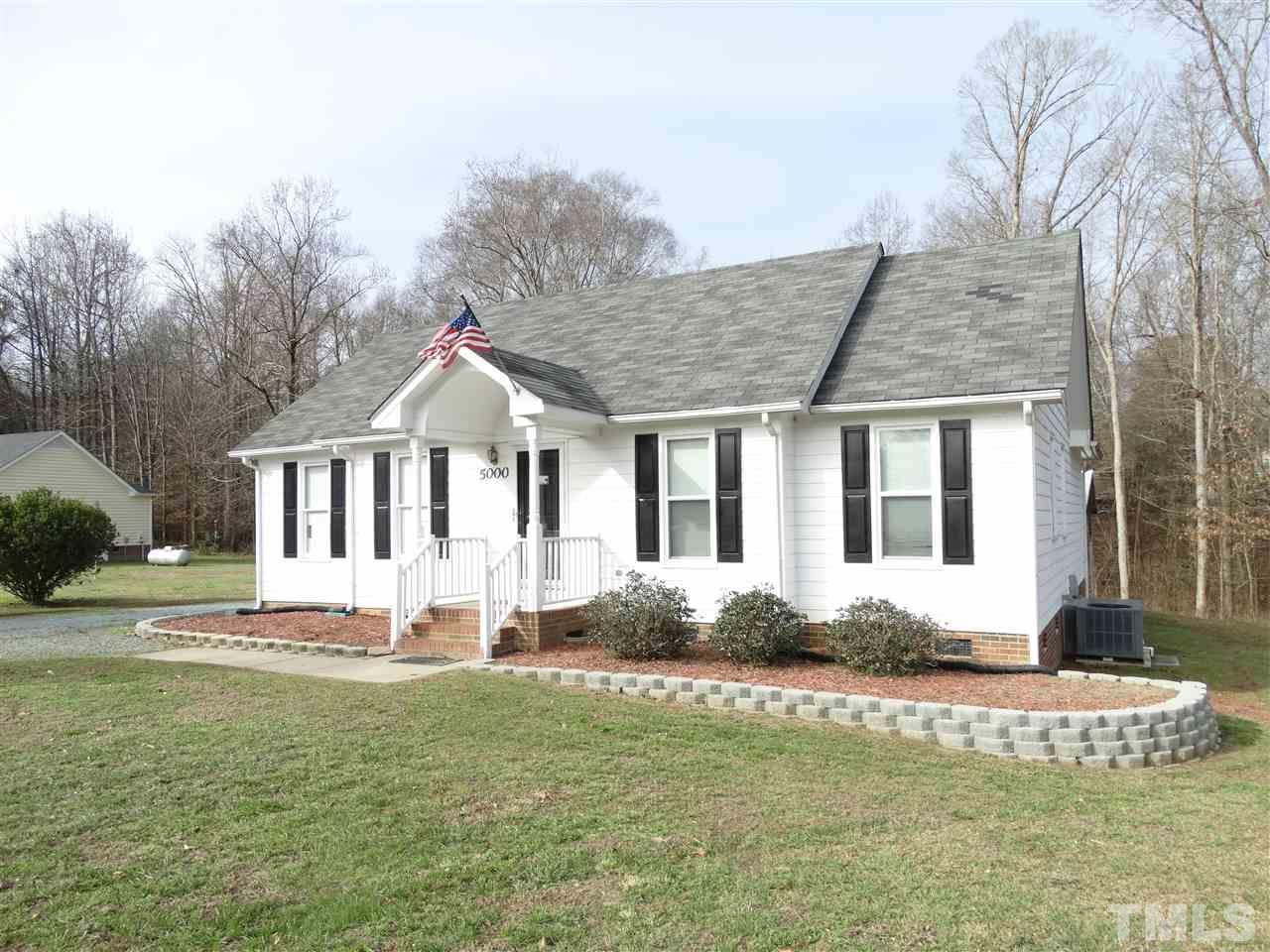 5000 Raleigh Road Benson, NC 27504 - Photo 3 of 25 a front view of a house with a yard