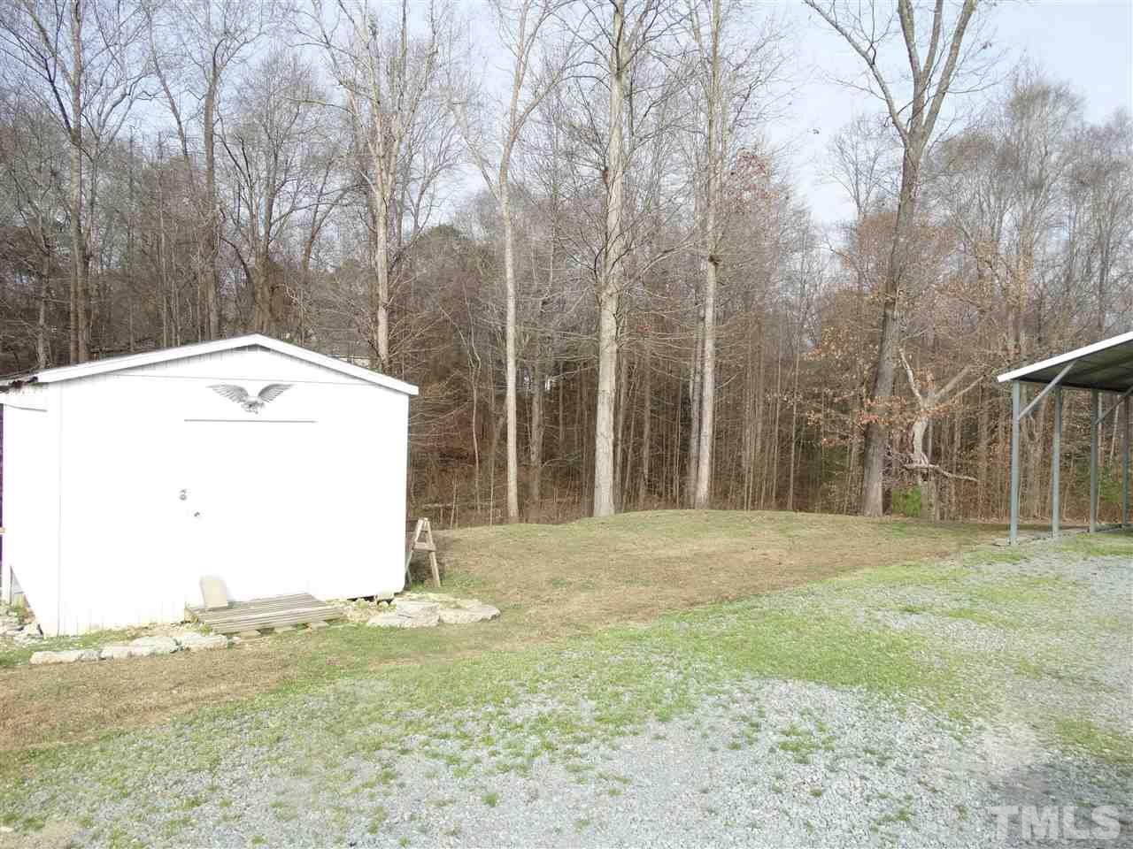 5000 Raleigh Road Benson, NC 27504 - Photo 23 of 25 a view of a backyard with large trees
