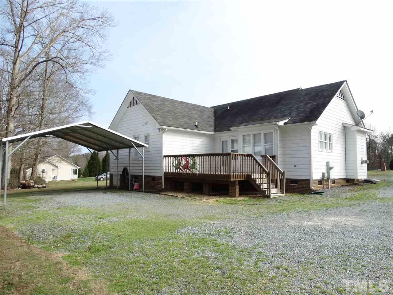 5000 Raleigh Road Benson, NC 27504 - Photo 25 of 25 a view of a house with a yard and sitting area