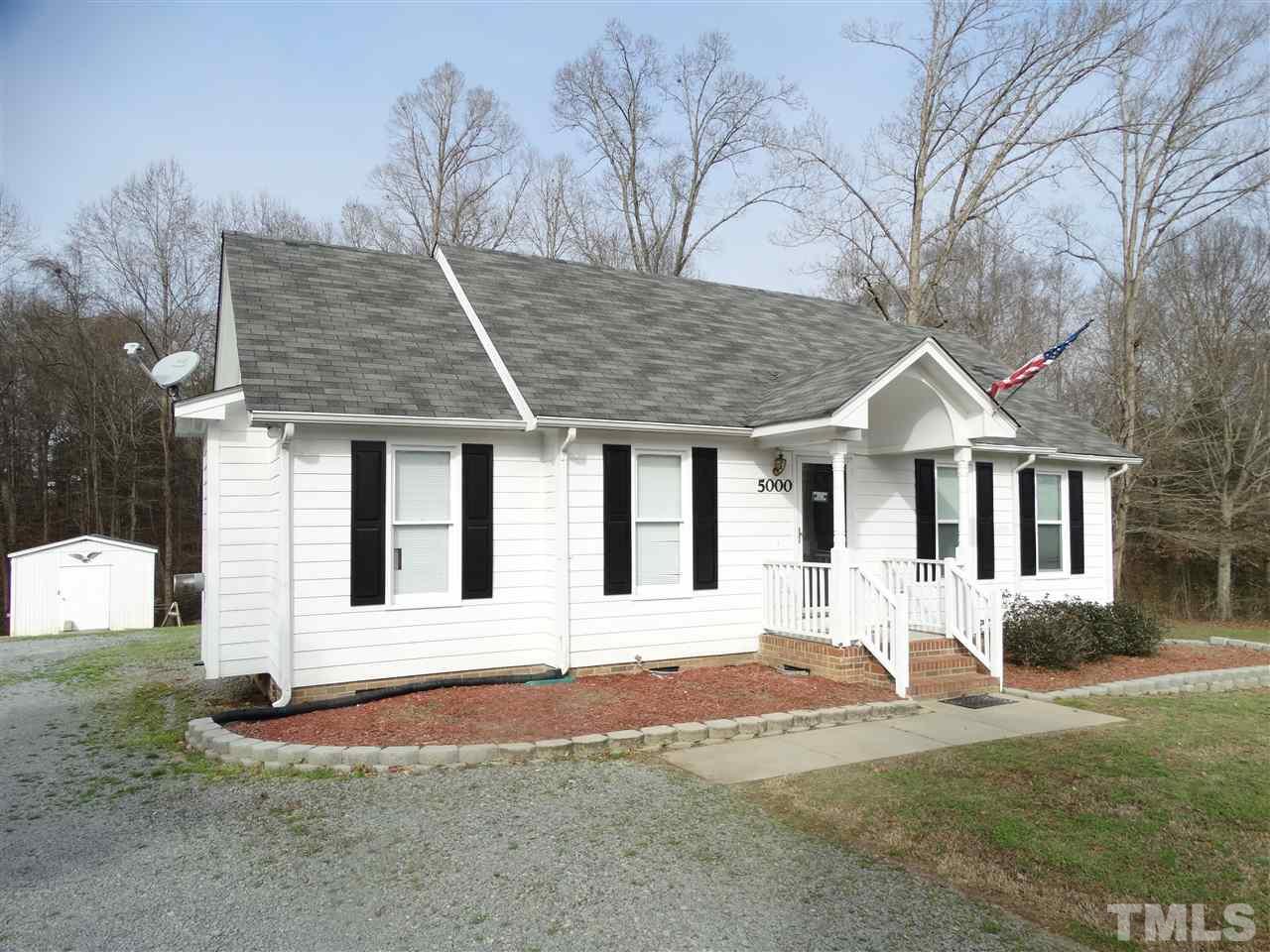 5000 Raleigh Road Benson, NC 27504 - Photo 4 of 25 a front view of a house with a yard