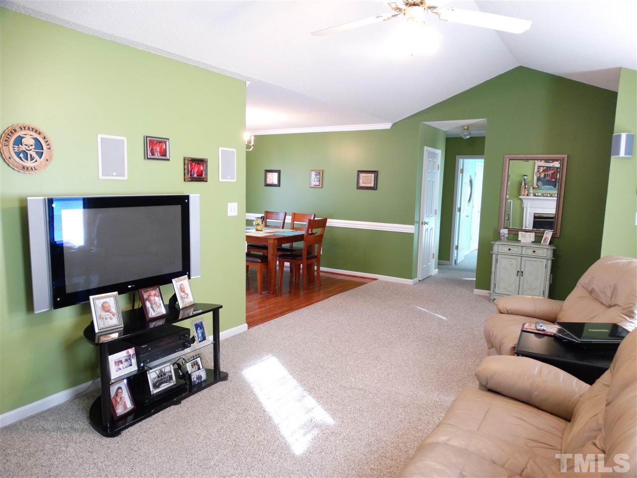 5000 Raleigh Road Benson, NC 27504 - Photo 8 of 25 a living room with furniture and a flat screen tv