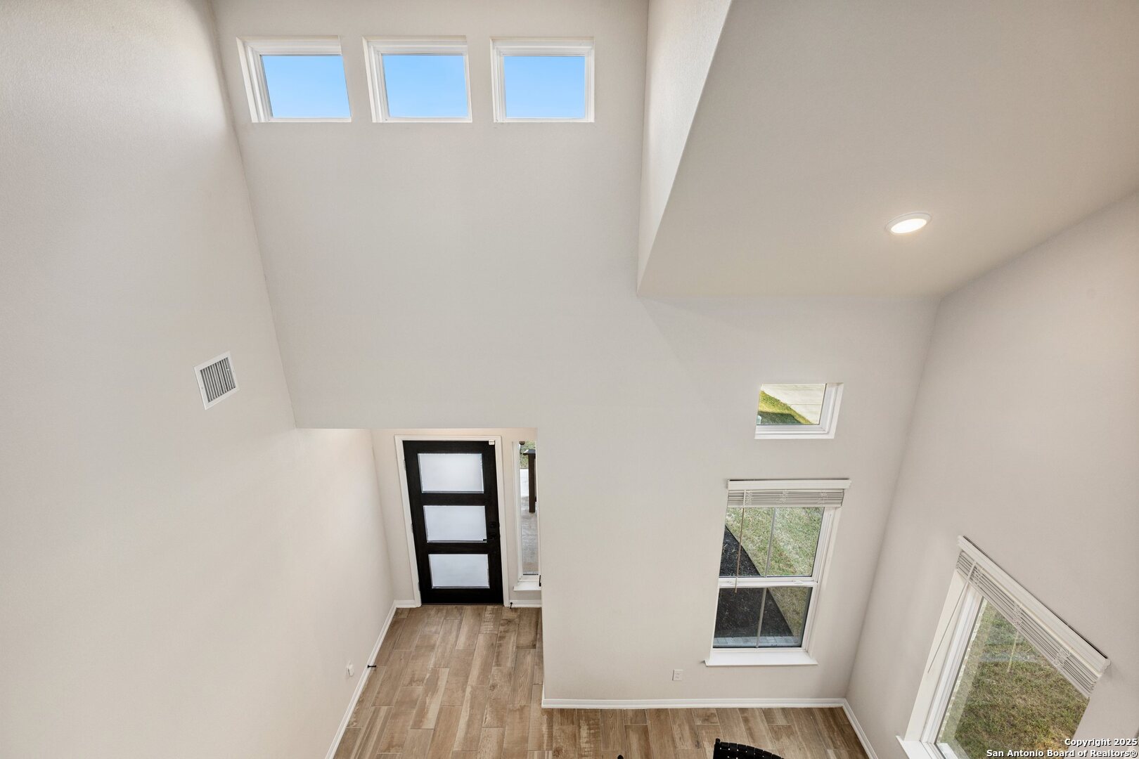 1707 Lawnside Road San Antonio, TX 78245 - Photo 11 of 64 an empty room with windows and entrance