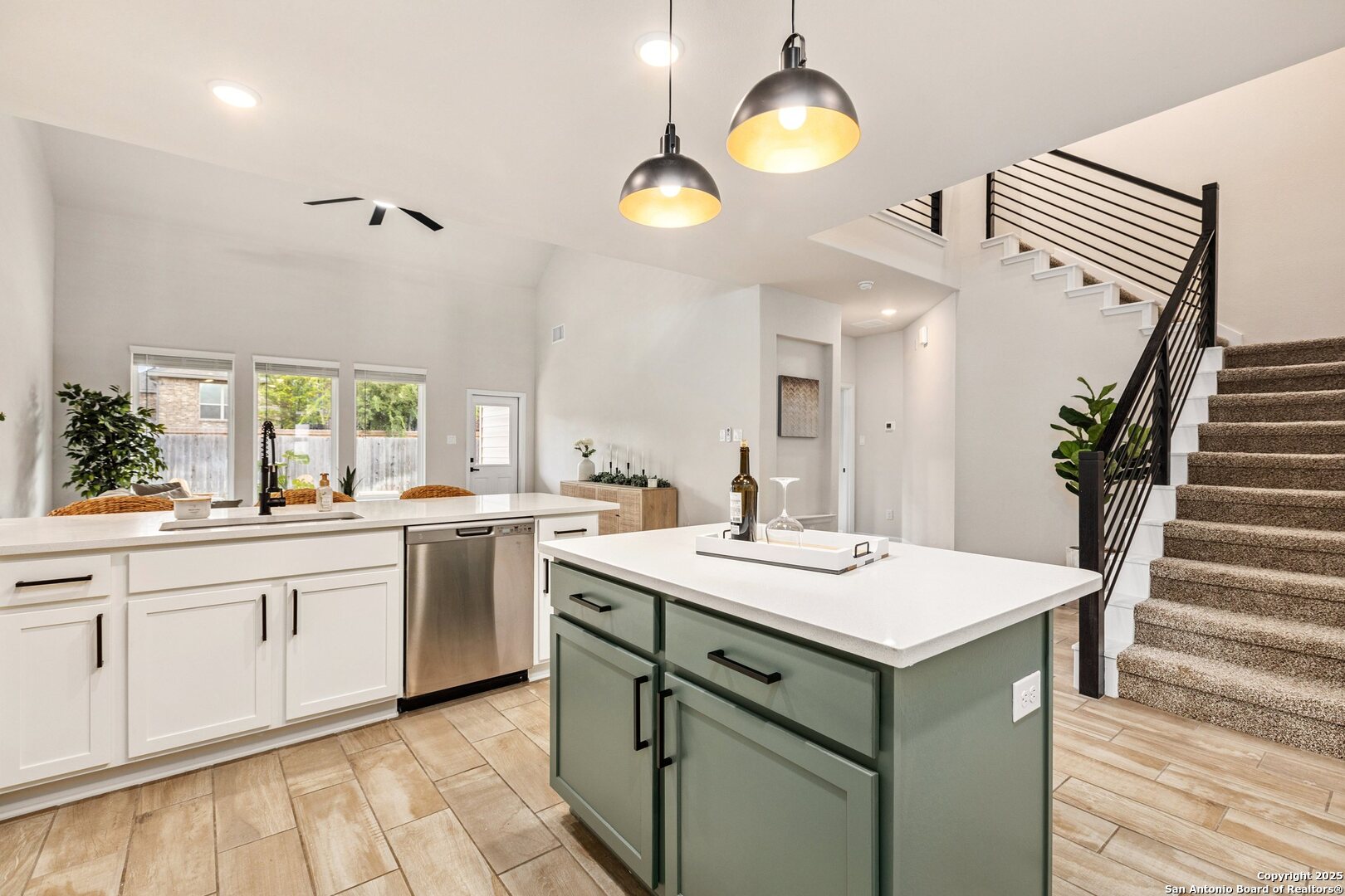 1707 Lawnside Road San Antonio, TX 78245 - Photo 2 of 64 a kitchen with a sink and a stove with wooden floor