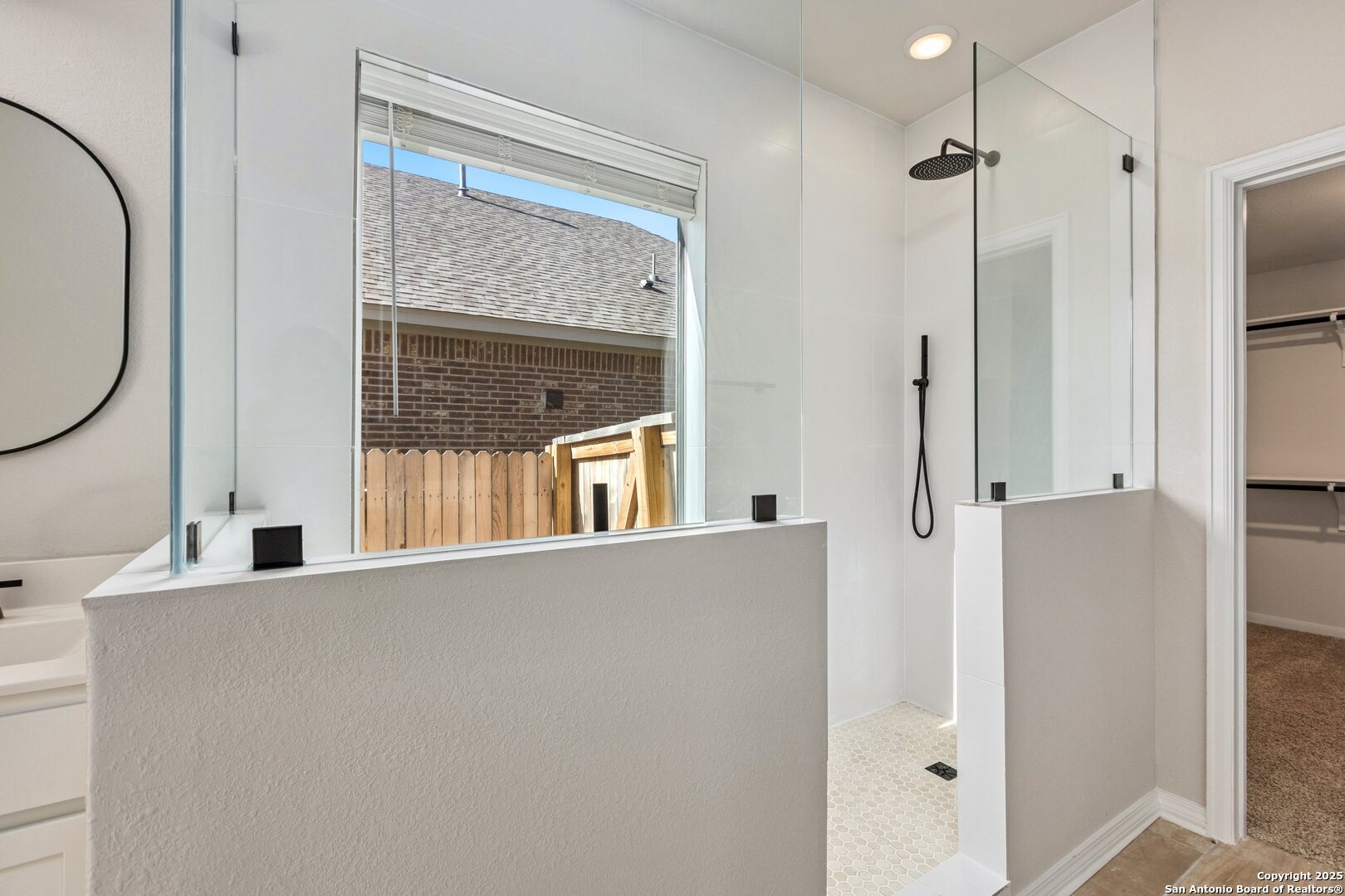 1707 Lawnside Road San Antonio, TX 78245 - Photo 27 of 64 a view of a living room with a large window and wooden floor