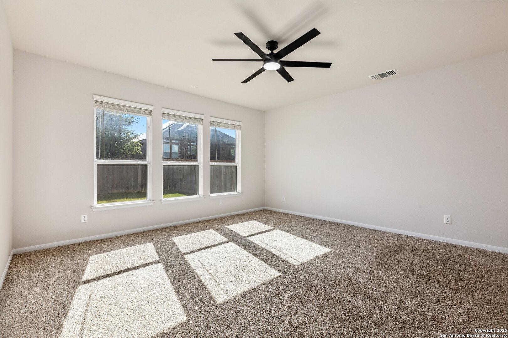 1707 Lawnside Road San Antonio, TX 78245 - Photo 39 of 64 a view of a ceiling fan and a large window
