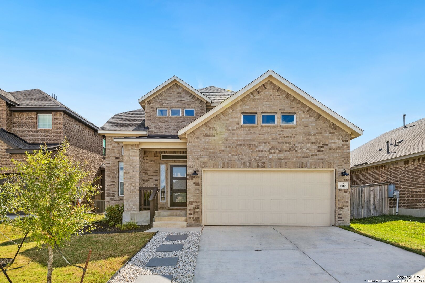 1707 Lawnside Road San Antonio, TX 78245 - Photo 4 of 64 a front view of a house with yard and parking