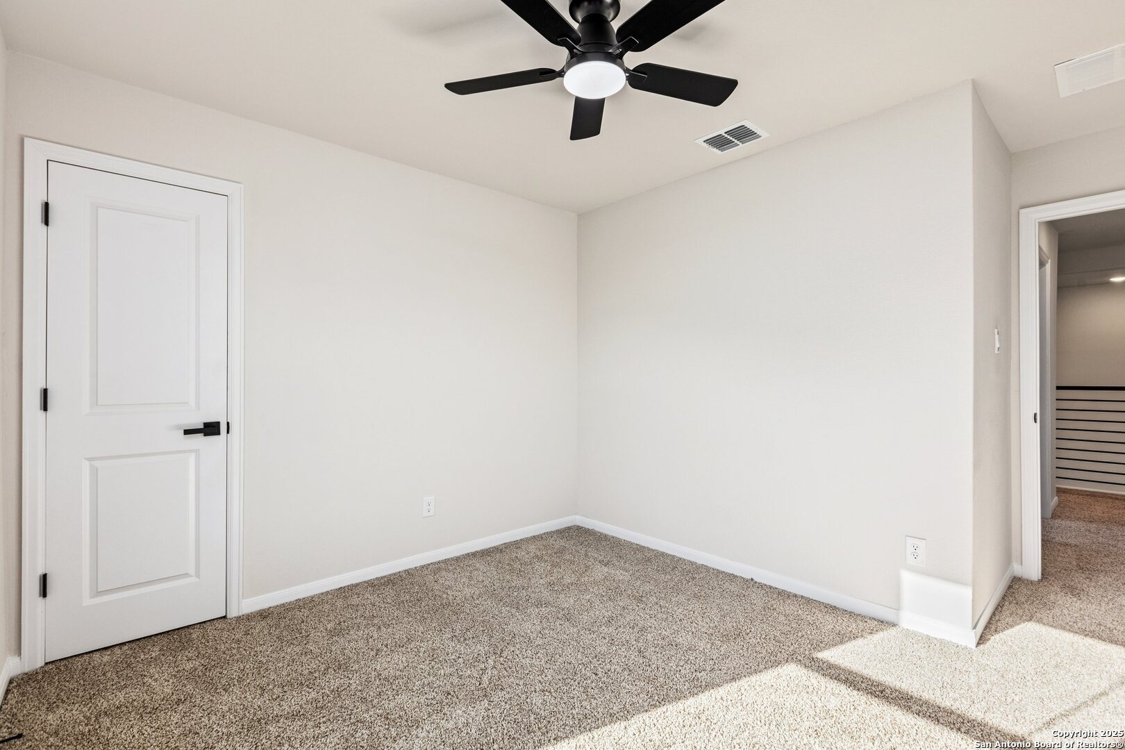 1707 Lawnside Road San Antonio, TX 78245 - Photo 51 of 64 a view of a hallway with a chandelier fan