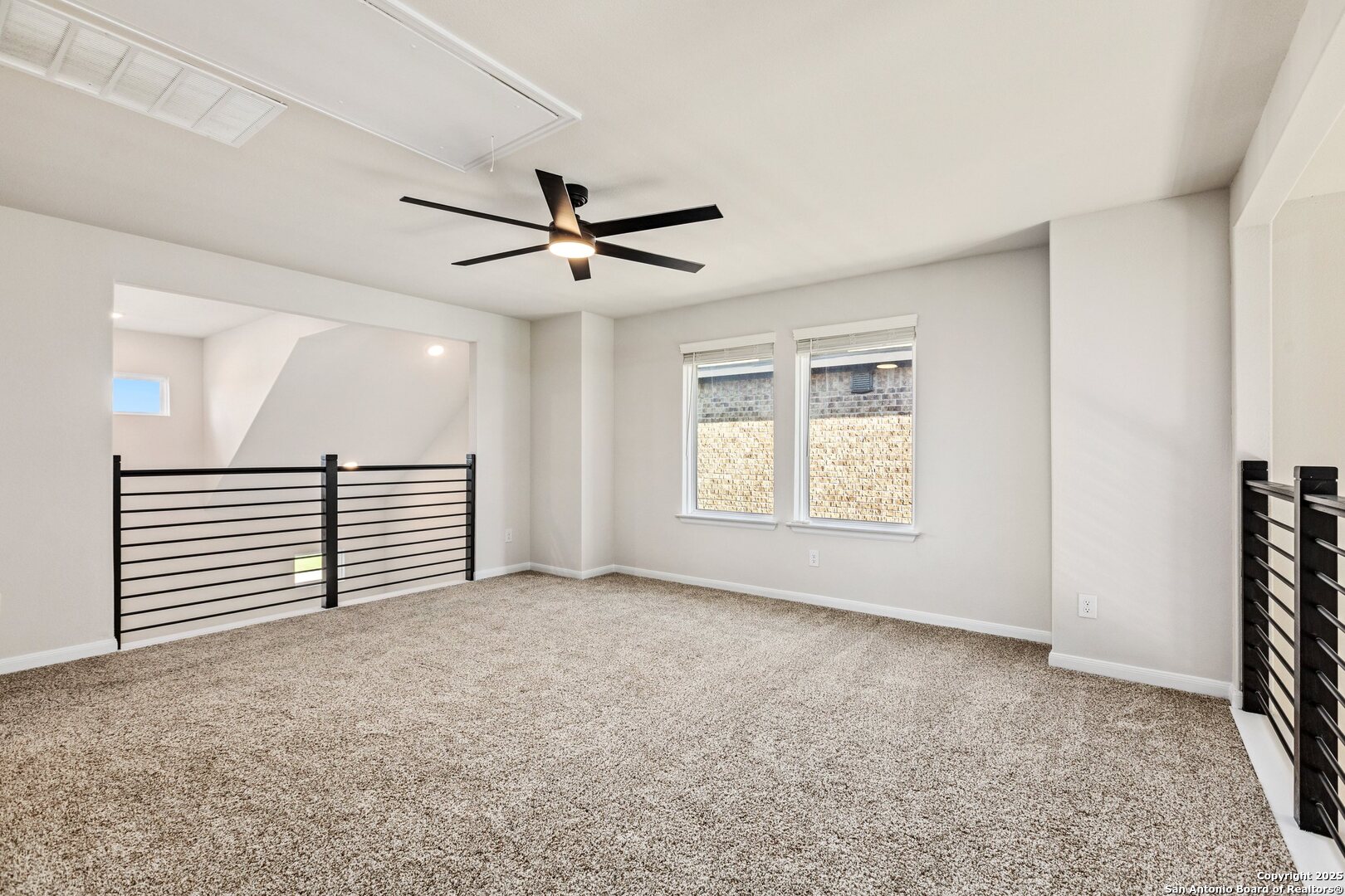 1707 Lawnside Road San Antonio, TX 78245 - Photo 54 of 64 an empty room with windows and ceiling fan