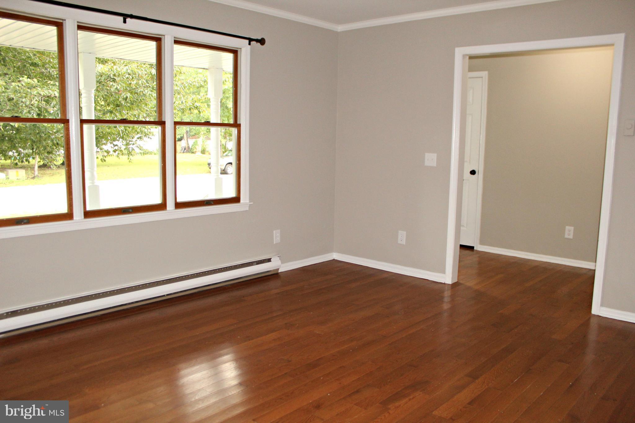 7054 Pine Ridge Road Easton, MD 21601 - Photo 11 of 30 Large living room with hardwood flooring!