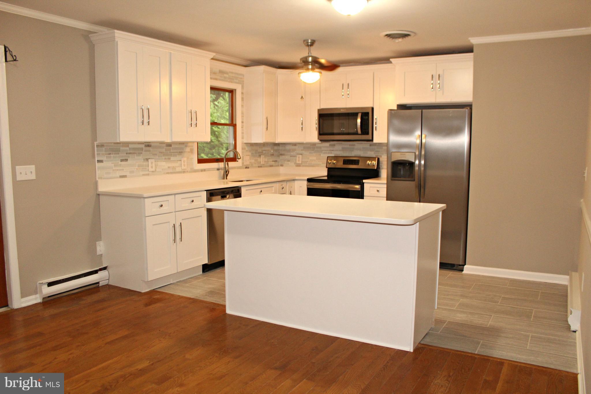 7054 Pine Ridge Road Easton, MD 21601 - Photo 3 of 30 New kitchen with quartz and stainless steel!