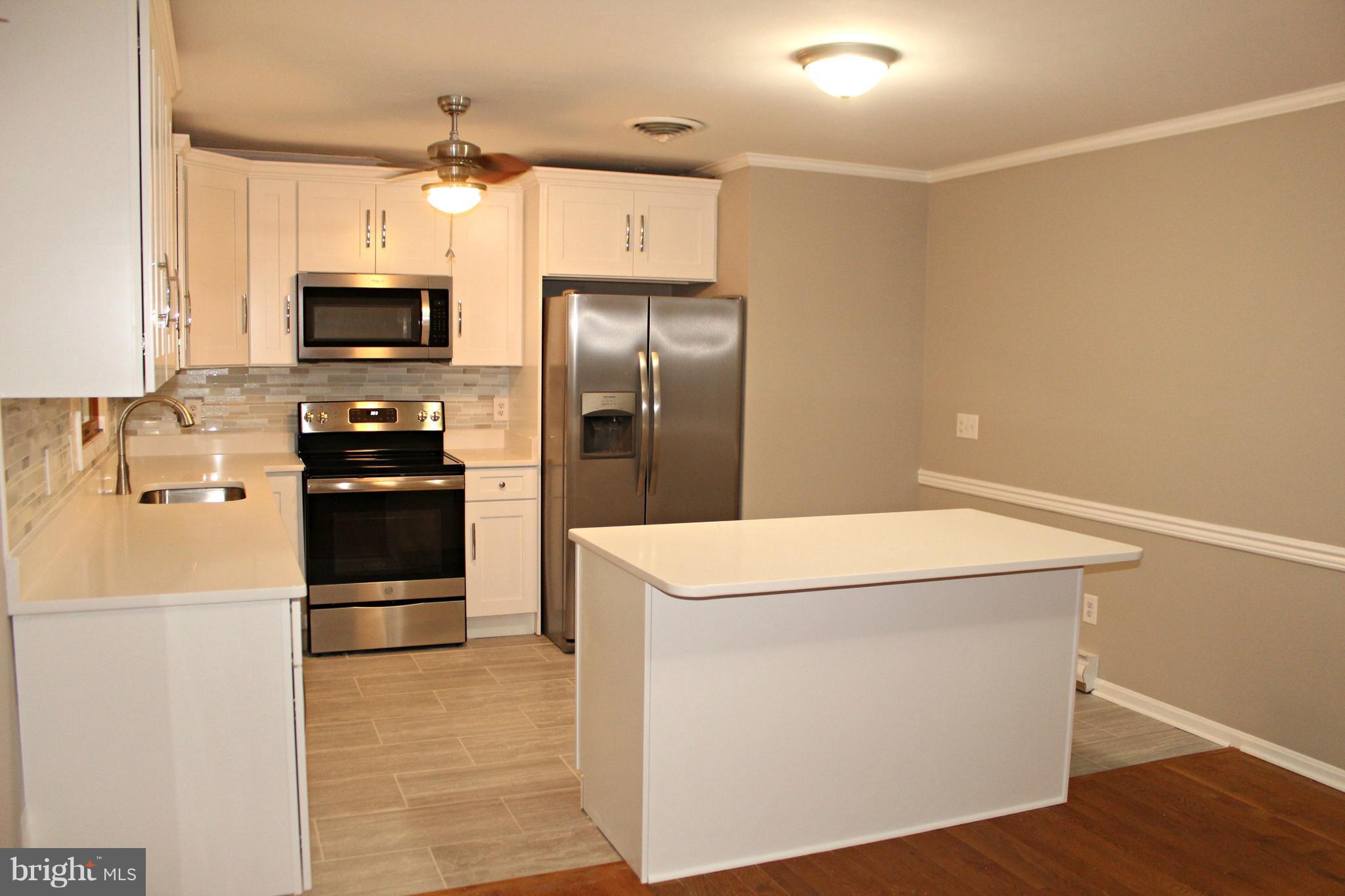 7054 Pine Ridge Road Easton, MD 21601 - Photo 4 of 30 New kitchen with quartz and stainless steel!