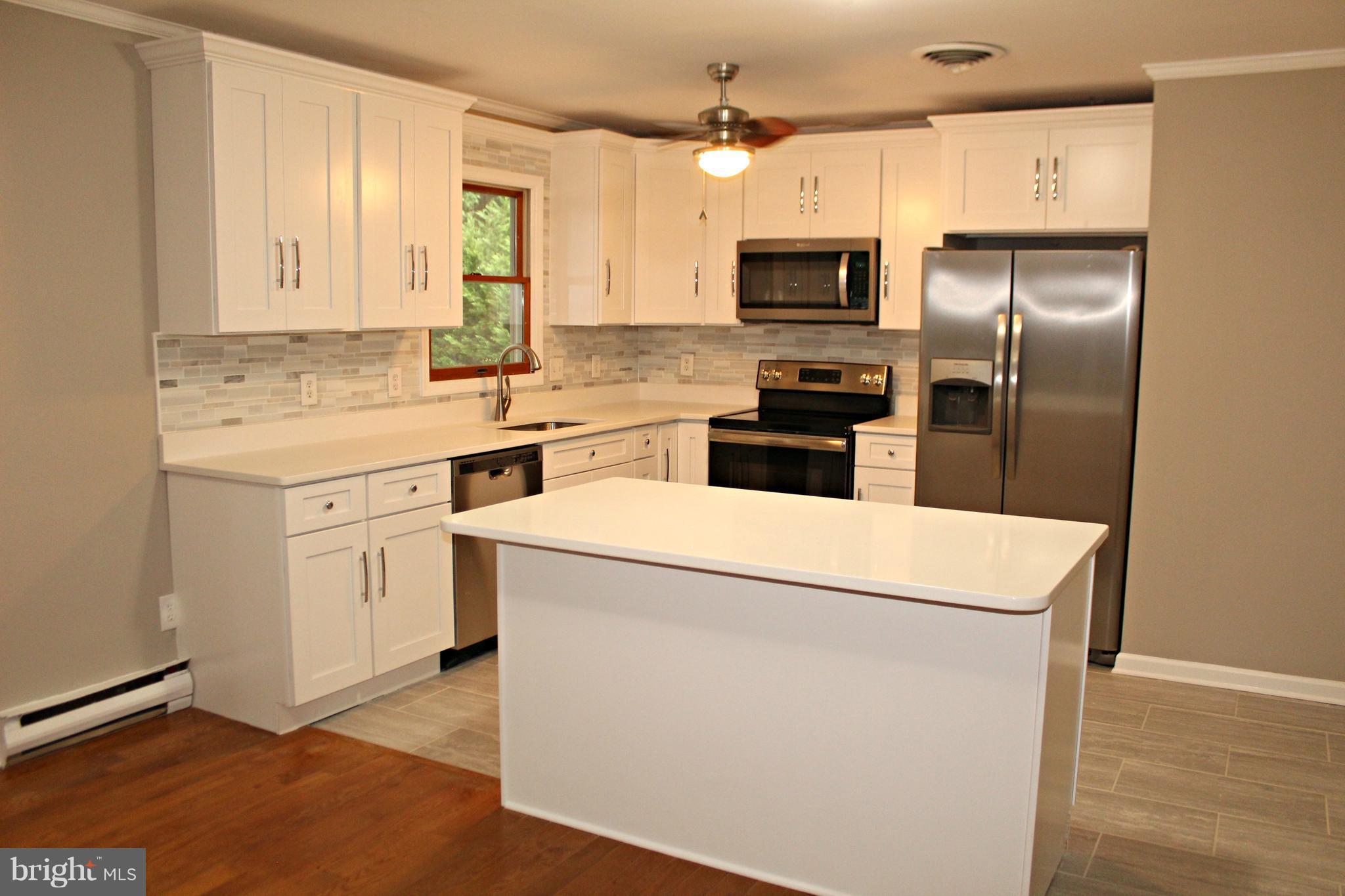 7054 Pine Ridge Road Easton, MD 21601 - Photo 6 of 30 New kitchen with quartz counter tops!