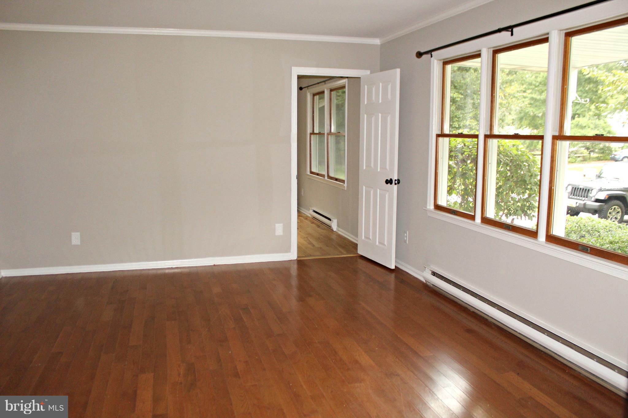 7054 Pine Ridge Road Easton, MD 21601 - Photo 10 of 30 Large living room with hardwood flooring!