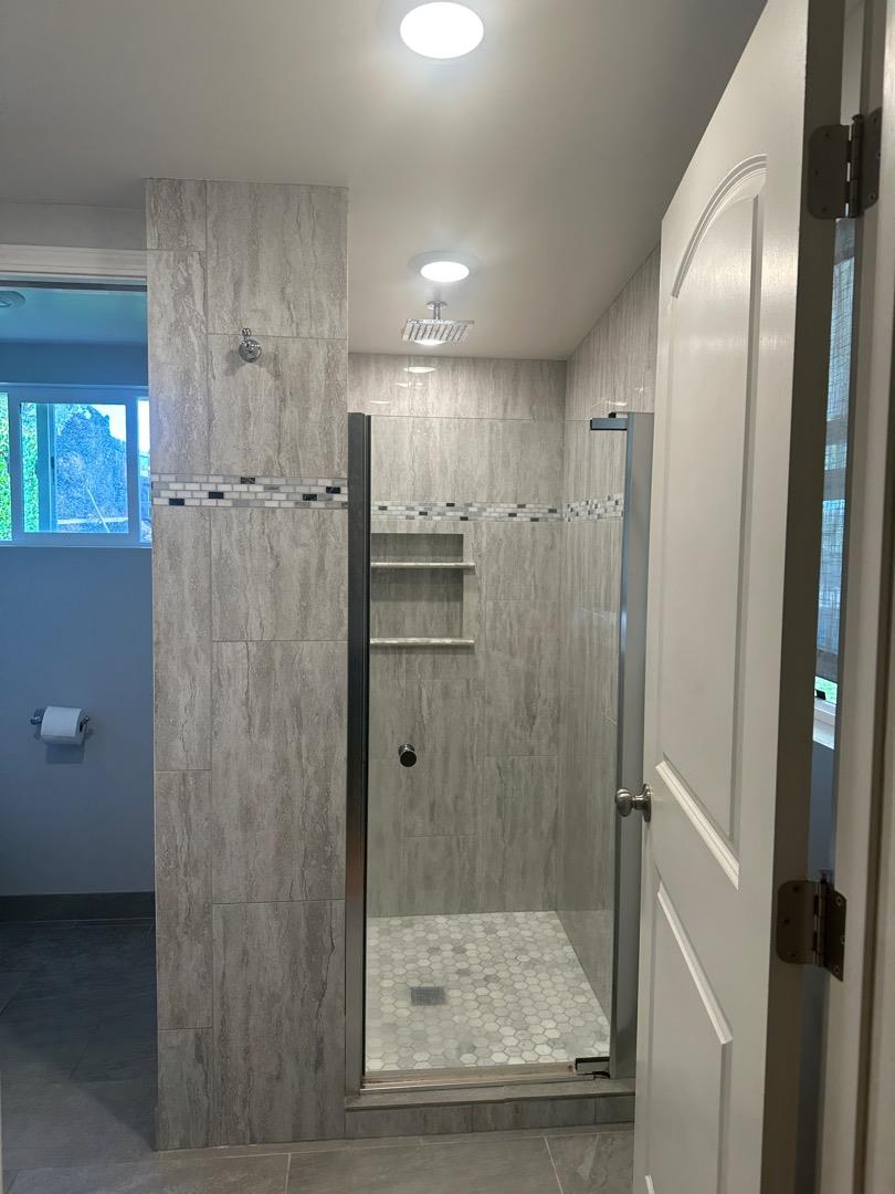 2061 Monticello Road Napa, CA 94558 - Photo 11 of 14 a bathroom with a glass door shower