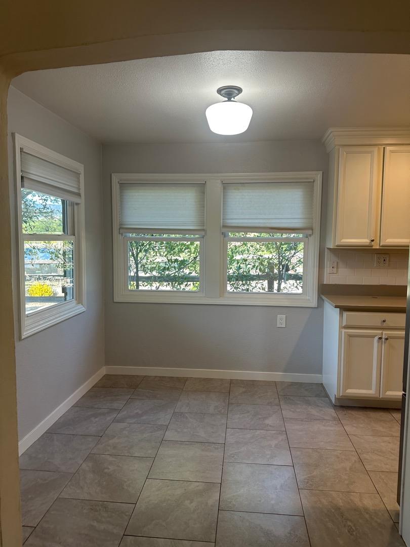 2061 Monticello Road Napa, CA 94558 - Photo 3 of 14 a view of an empty room with a window