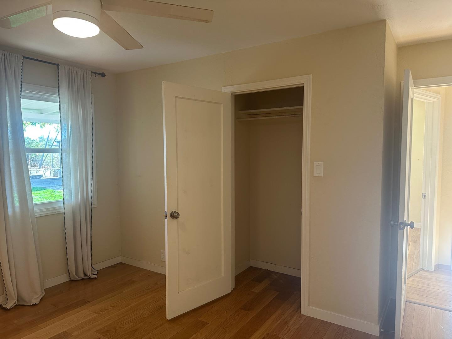 2061 Monticello Road Napa, CA 94558 - Photo 8 of 14 an empty room with wooden floor and closet