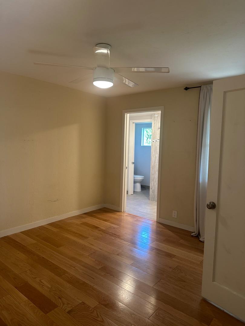 2061 Monticello Road Napa, CA 94558 - Photo 9 of 14 a view of a room with wooden floor and a bathroom