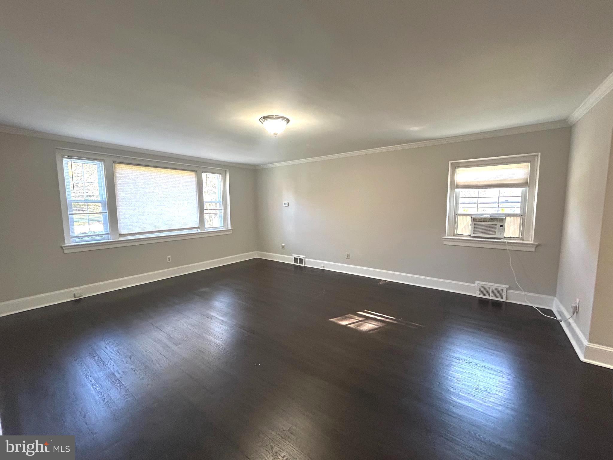 248 Hilldale Road Villanova, PA 19085 - Photo 11 of 21 an empty room with wooden floor and windows