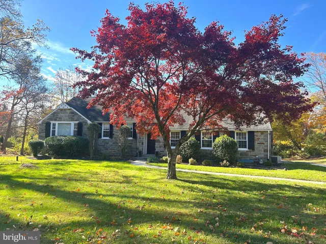 a view of house with yard in front of house