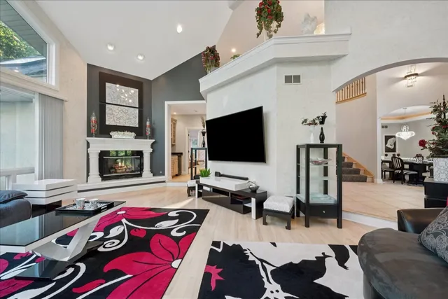 a view of a chair and table in backyard of the house