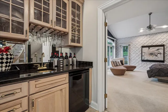 a living room with furniture a flat screen tv and a faucet