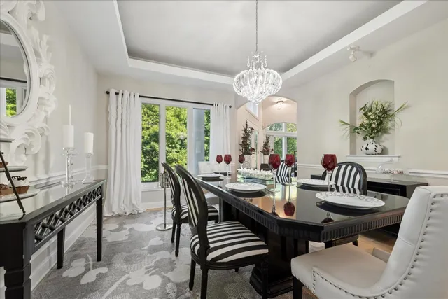 a bedroom with a large bed and a large window