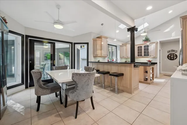 a bathroom with a granite countertop sink mirror and shower