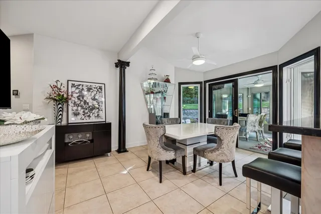 a view of a room with wooden floor and windows