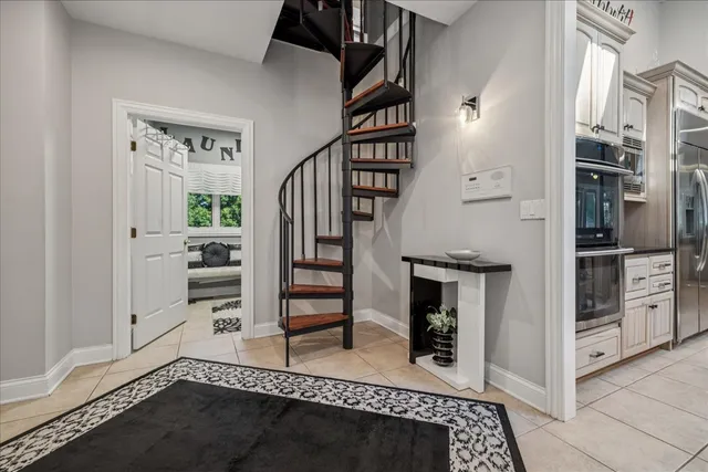 a bathroom with a sink a toilet a mirror and shower