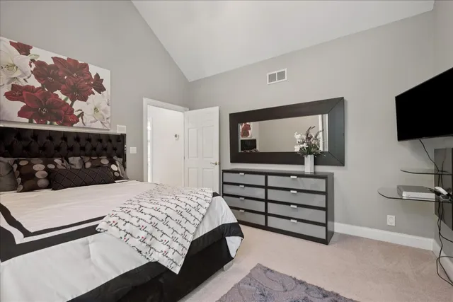a bedroom with furniture and a book shelf