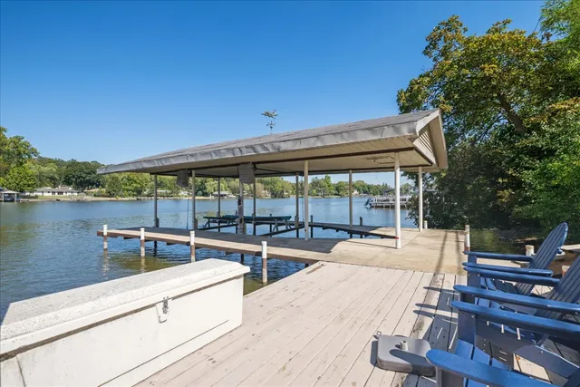 a front view of a house with a yard and a garden
