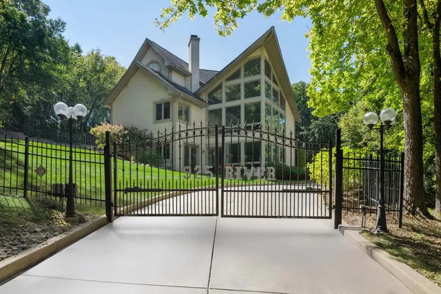 a living room with furniture flat screen tv and a large window