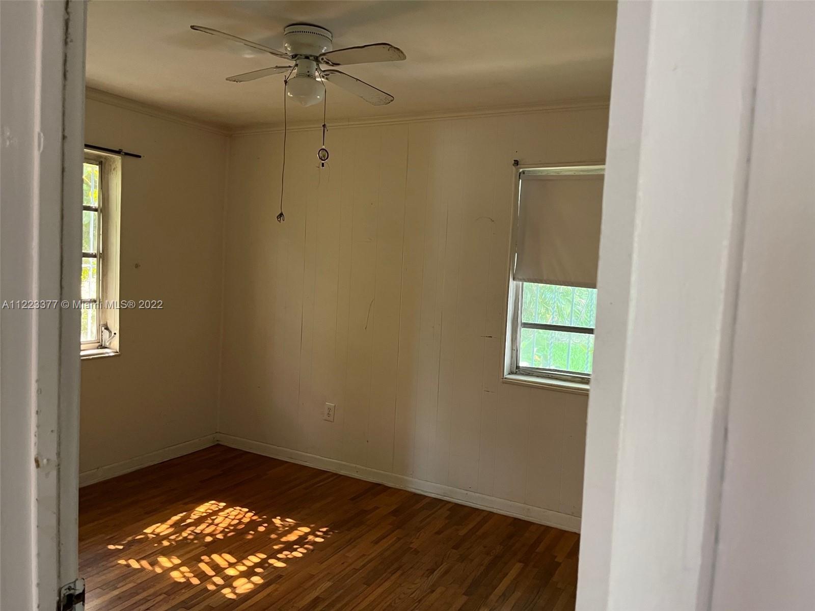 Miami-Dade County Miami, FL 33161 - Photo 7 of 10 an empty room with windows