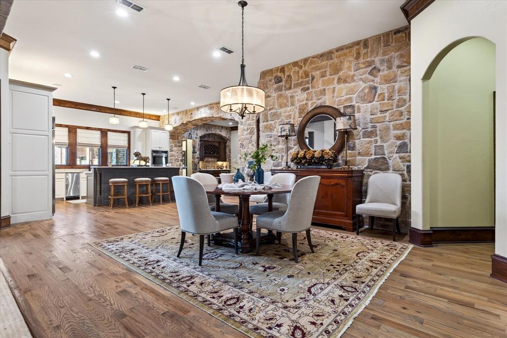 1625 Timber Ridge Trail Cross Roads, TX 76227 - Photo 16 of 40 Dining room with arched walkways, light wood finished floors, and recessed lighting