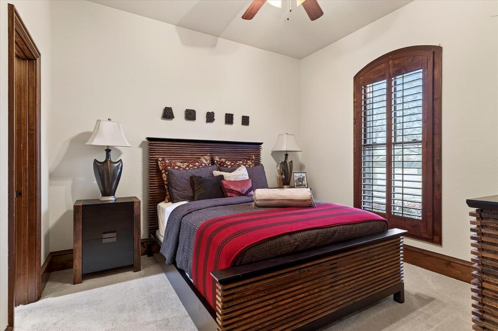 1625 Timber Ridge Trail Cross Roads, TX 76227 - Photo 19 of 40 Bedroom with light colored carpet and ceiling fan