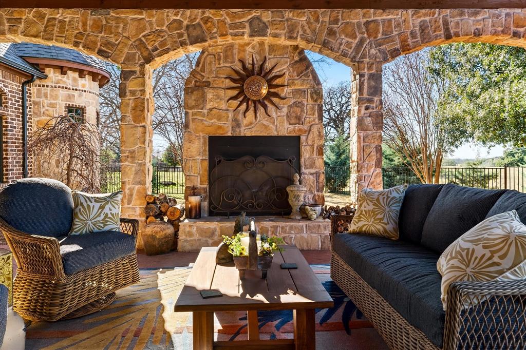 1625 Timber Ridge Trail Cross Roads, TX 76227 - Photo 36 of 40 View of patio with an outdoor living space with a fireplace