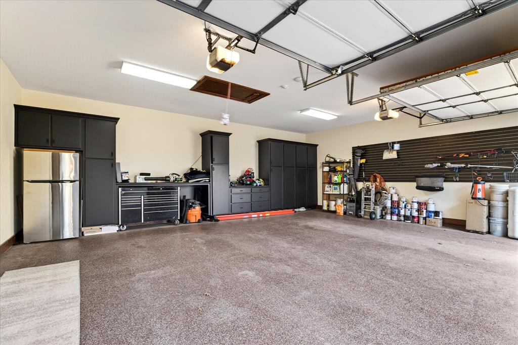 1625 Timber Ridge Trail Cross Roads, TX 76227 - Photo 38 of 40 Garage with freestanding refrigerator and a garage door opener