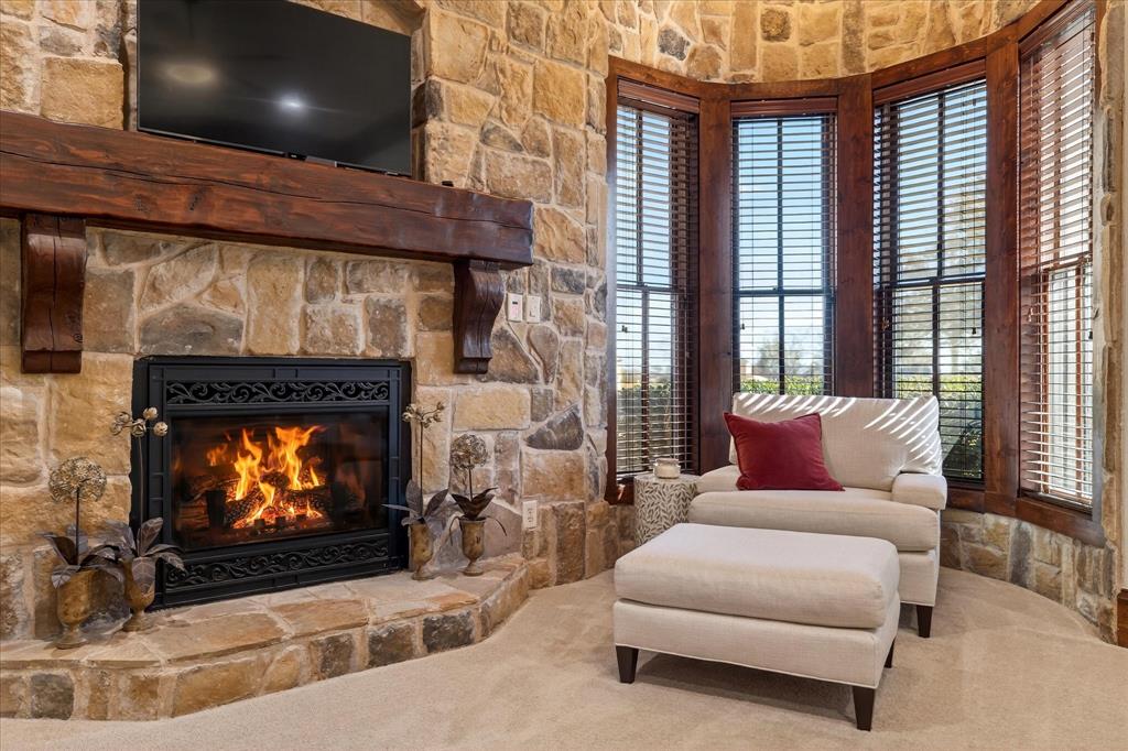 1625 Timber Ridge Trail Cross Roads, TX 76227 - Photo 7 of 40 Living area featuring a stone fireplace and carpet floors