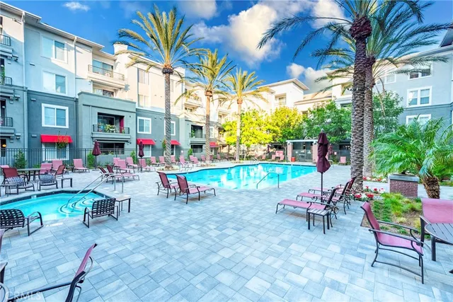 a view of a chairs and table in a backyard