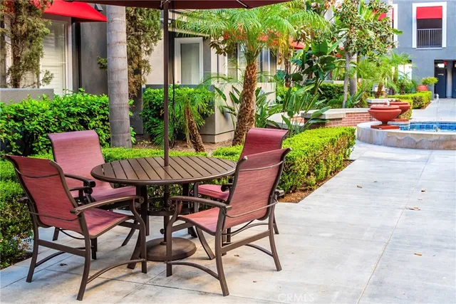 a view of a chairs and table in patio