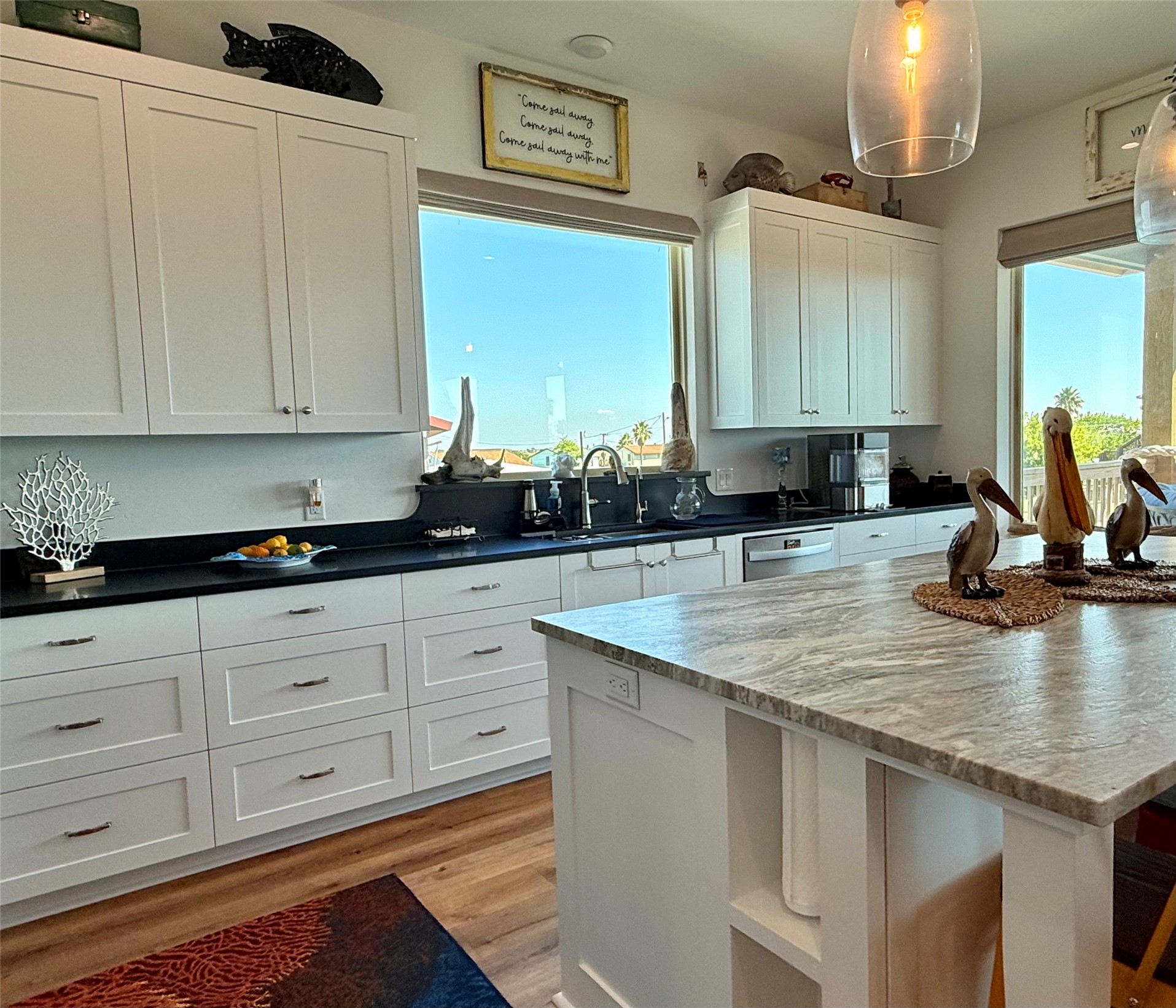 2023 County Road 201 Sargent, TX 77414 - Photo 16 of 45 a kitchen with sink cabinets and window