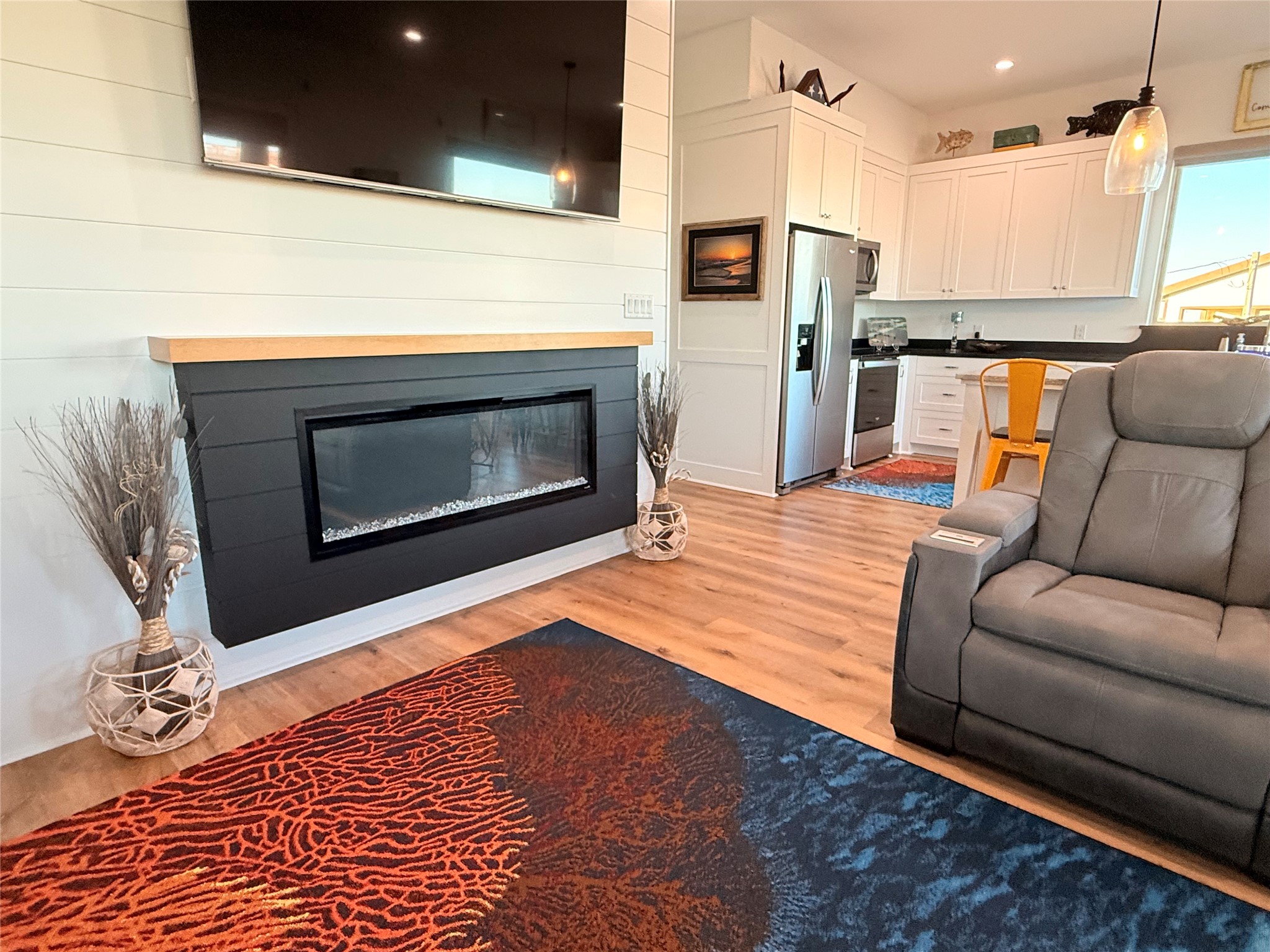 2023 County Road 201 Sargent, TX 77414 - Photo 18 of 45 a living room with furniture and a fireplace