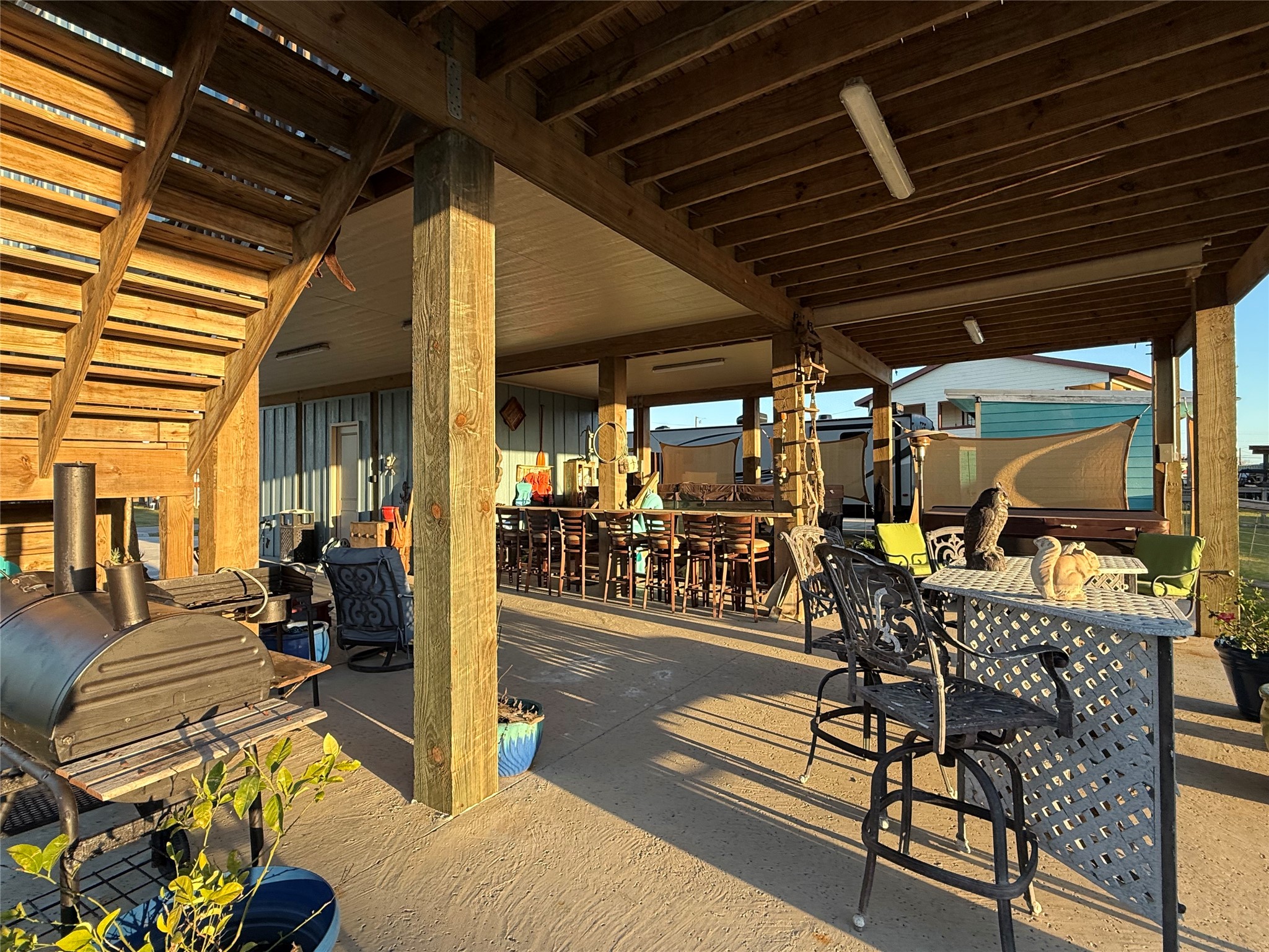 2023 County Road 201 Sargent, TX 77414 - Photo 44 of 45 a view of a chairs and tables in patio