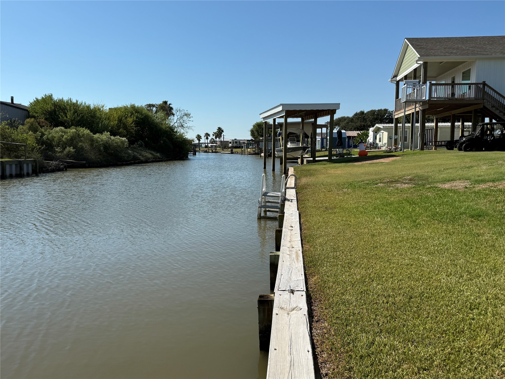 2023 County Road 201 Sargent, TX 77414 - Photo 9 of 45 a front view of a house with garden
