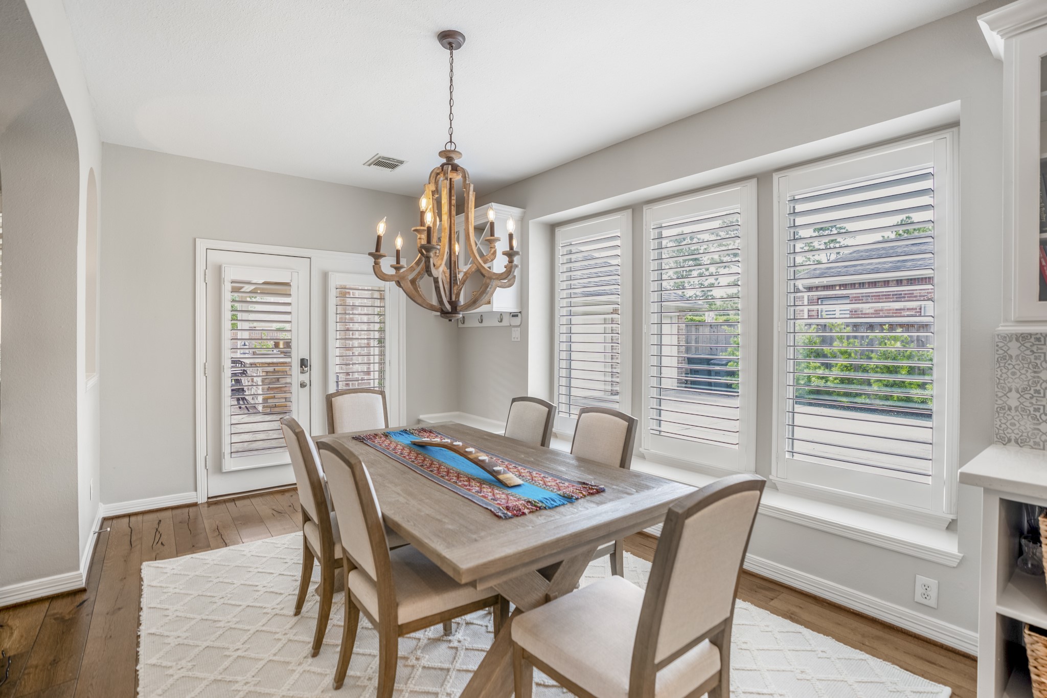 9707 Blue Cruls Way Spring, TX 77379 - Photo 23 of 50 a view of a dining room with furniture window and wooden floor
