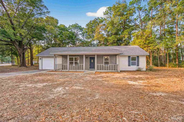 front view of a house with a yard