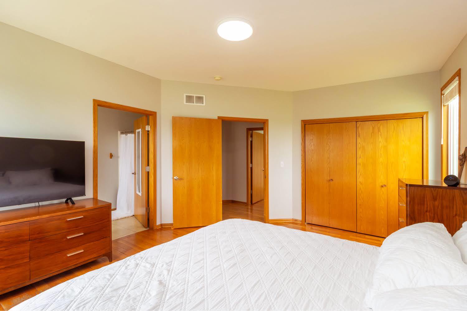 16649 Beaverton Road Capron, IL 61012 - Photo 17 of 48 a bedroom with a bed and flat screen tv