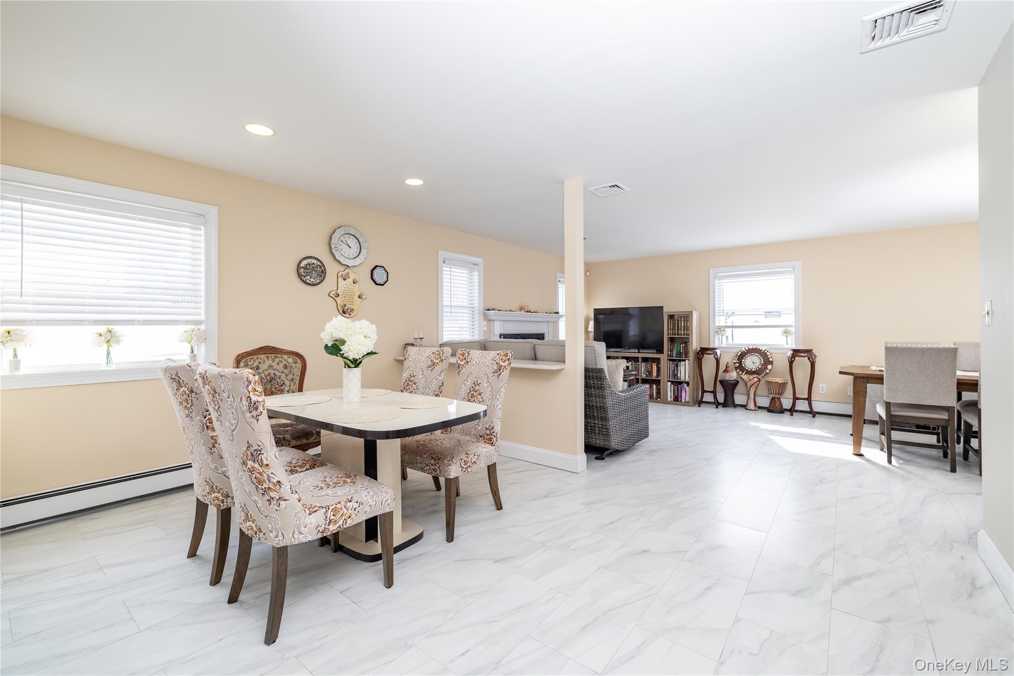 458 East Pine Street Long Beach, NY 11561 - Photo 11 of 26 a view of a dining room with furniture and chandelier