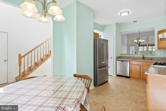 a bedroom with a bed dresser and a large mirror