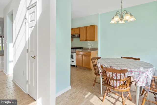 a kitchen with a table and chairs in it